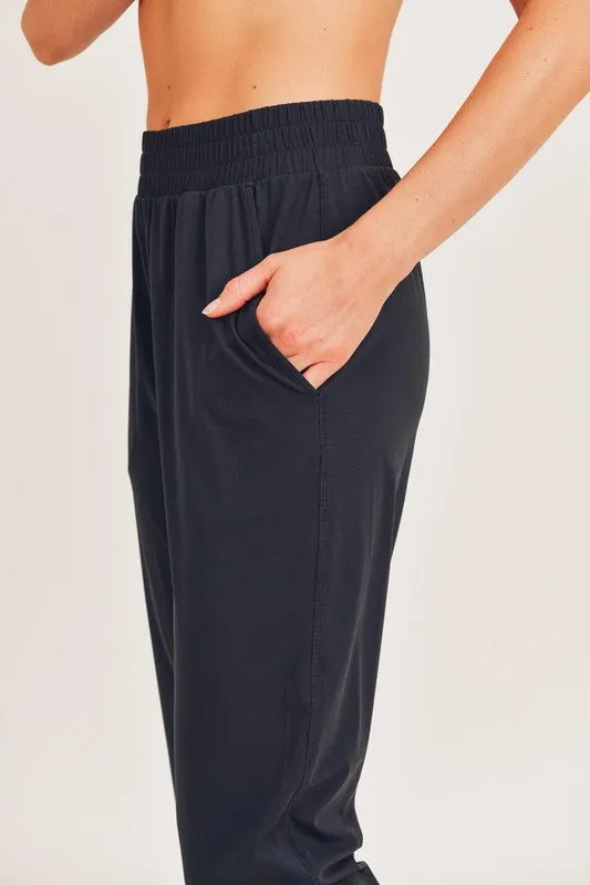 ATHLEISURE JOGGERS WITH CURVED NOTCH HEM
